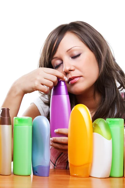 Young woman with cosmetics — Stock Photo, Image