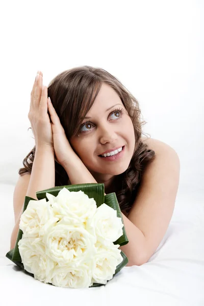 Young bride with a wedding bouquet — Stock Photo, Image