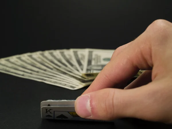 Person looking at his cards — Stock Photo, Image