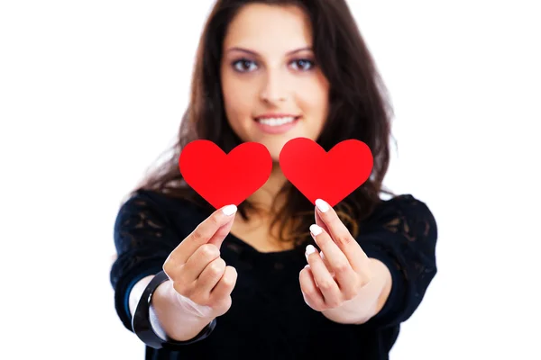 Ung kvinna med röda hjärtan — Stockfoto