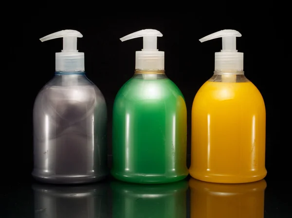 Tres botellas de jabón líquido — Foto de Stock