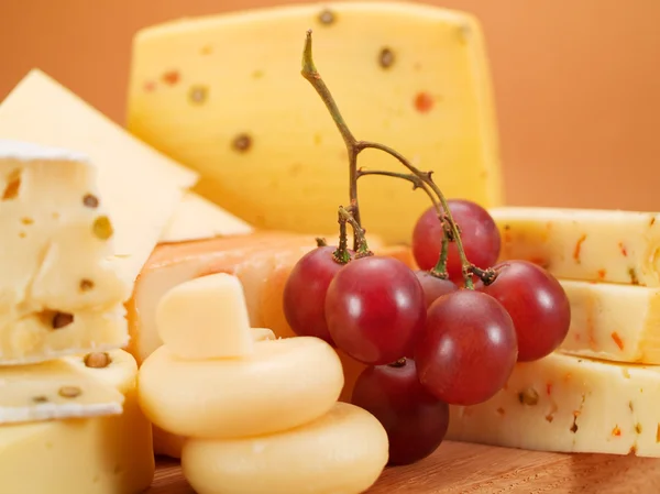 Tasty Cheese on background — Stock Photo, Image