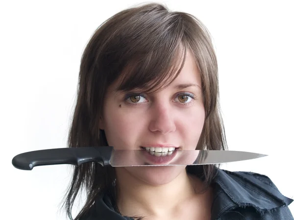 Woman with a knife in her mouth — Stock Photo, Image