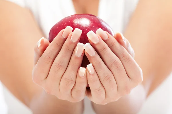 Young woman holding red apple — Stock Photo, Image