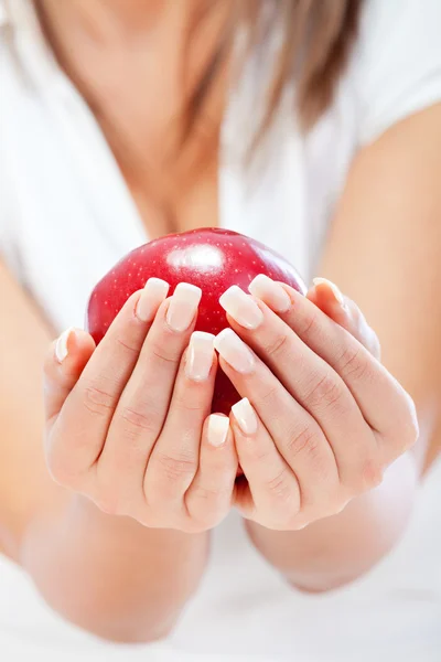 Young woman holding red apple — Stock Photo, Image