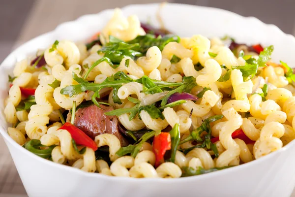 Pasta with prosciutto and spinach — Stock Photo, Image