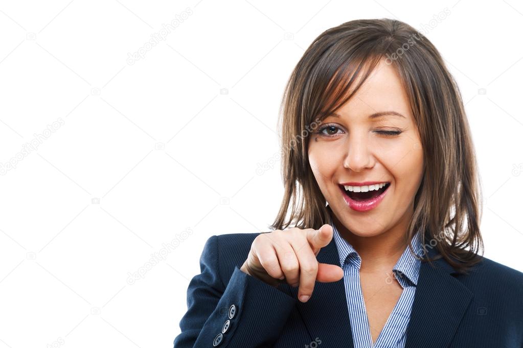Businesswoman pointing and winking