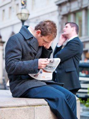 young businessmen staying in front of City