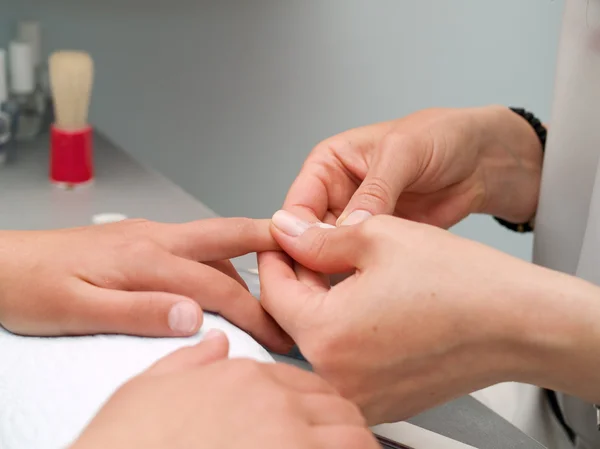 Girl fingernails being manicured. — Stock Photo, Image