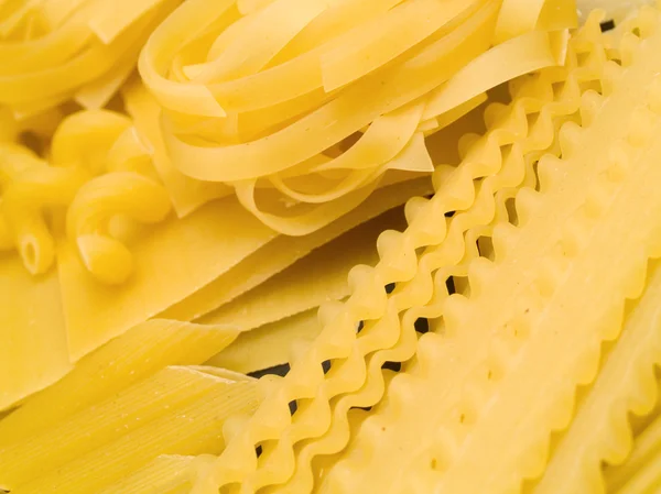 Raw Pasta on background — Stock Photo, Image