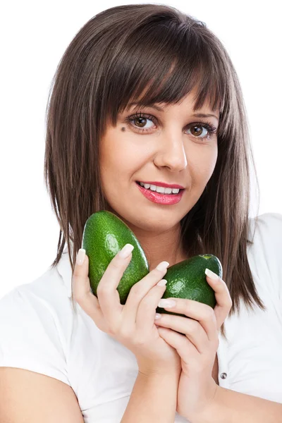 Jonge vrouw bedrijf avocado — Stockfoto