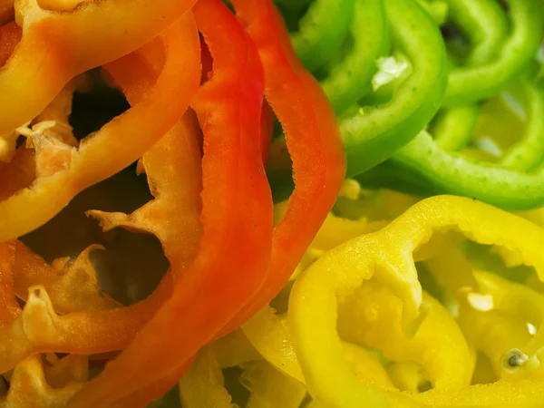 Slices of colorful peppers — Stock Photo, Image