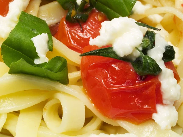 Fettucini prepared with fried cherry tomatoes — Stock Photo, Image