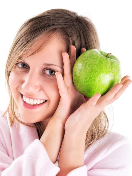 Frau im Hausmantel mit Apfel — Stockfoto