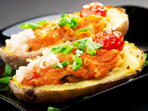 Stuffed potatos with tomatoes — Stock Photo, Image