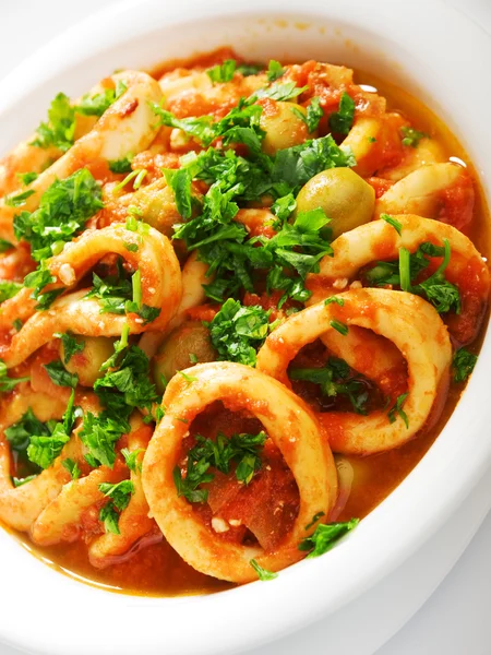 Calamari stewed in tomato — Stock Photo, Image