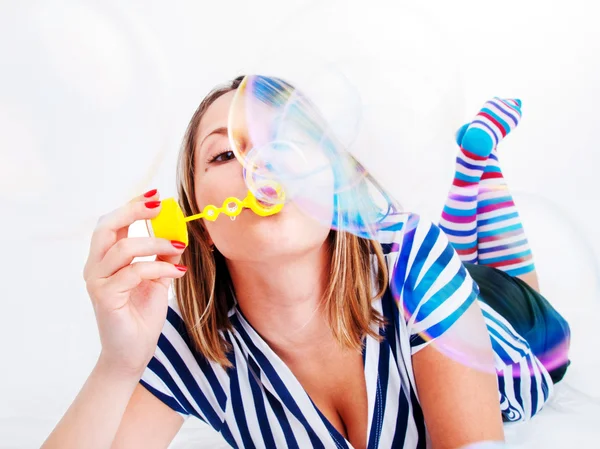 Girl blowing bubbles — Stock Photo, Image