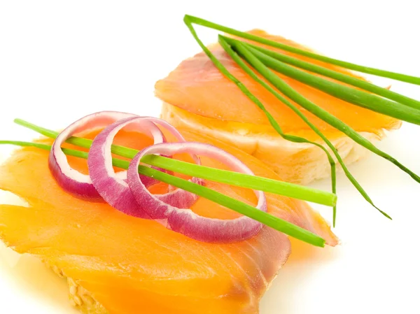 Sanduíches com salmão no fundo — Fotografia de Stock