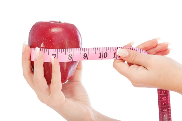 Apple with measuring tape Stock Image