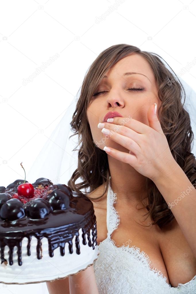 Young bride eating cake