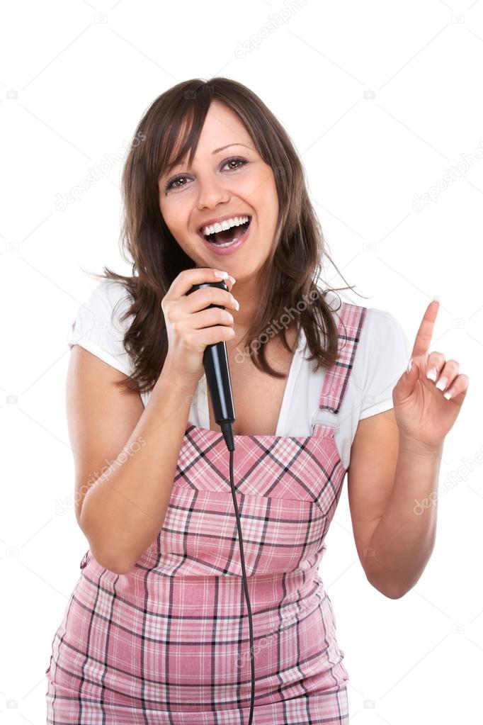 Young woman singing with  microphone