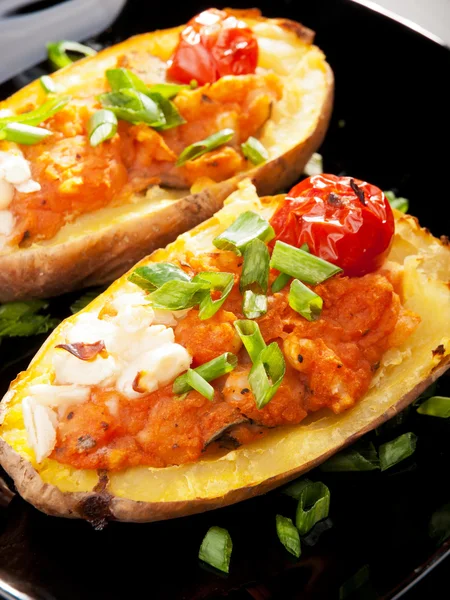 Stuffed potatos with tomatoes — Stock Photo, Image