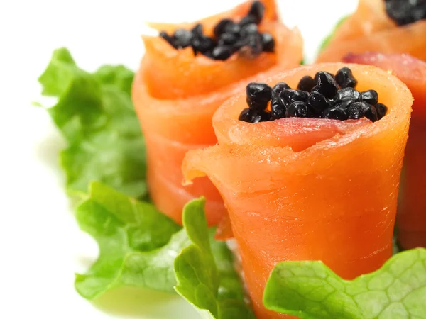 Salmon rolls with caviar on background — Stock Photo, Image