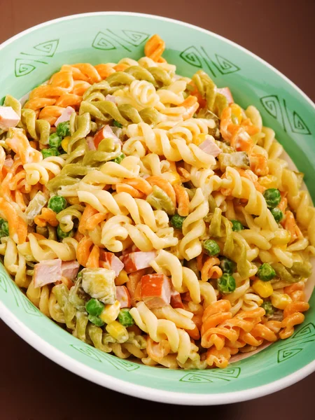 Fusilli with peas and ham — Stock Photo, Image