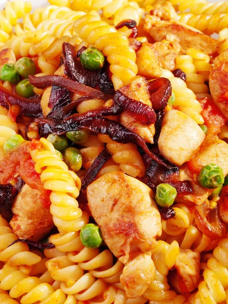 Fusilli with peas and chicken — Stock Photo, Image