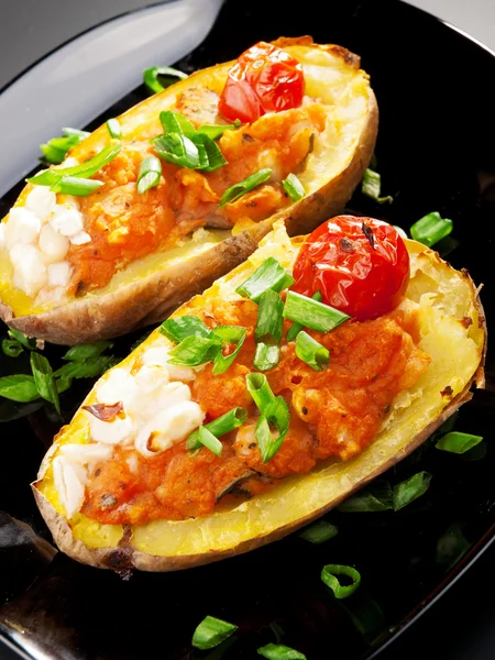 Stuffed potatos with tomatoes — Stock Photo, Image