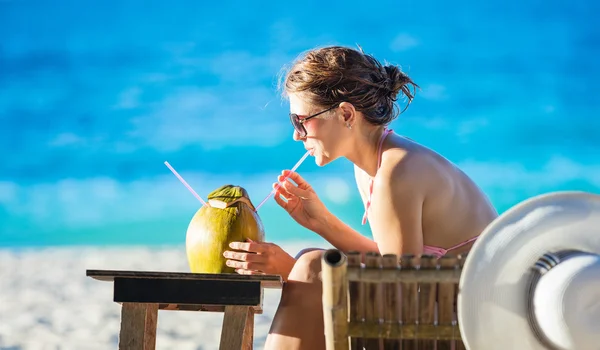 Woman with coconut cocktail — Stock Photo, Image