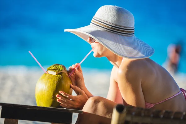 Woman with coconut cocktail — Stock Photo, Image