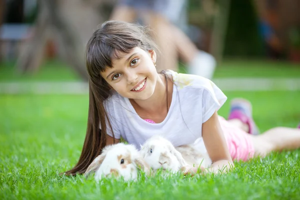 Girl with pet rabbits — Stock Photo, Image