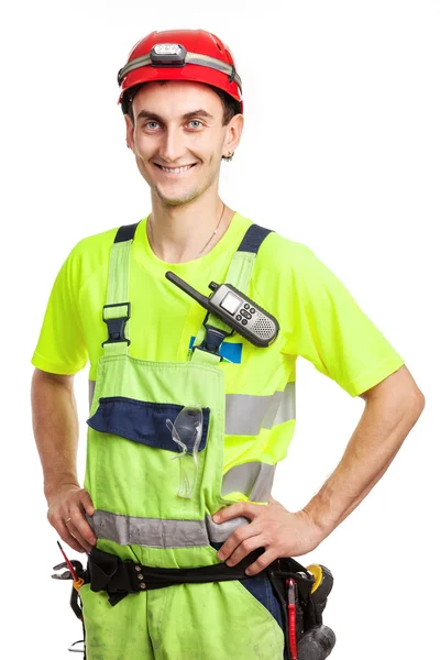 Young handsome contractor in light green uniform. Isolated over white background — Stock Photo, Image