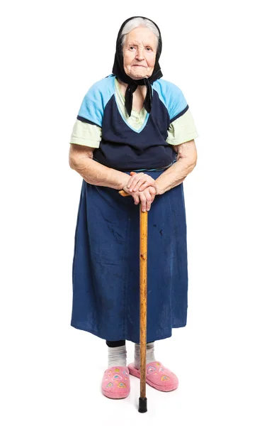 一个拄着拐杖在白色背景上的老女人 — 图库照片