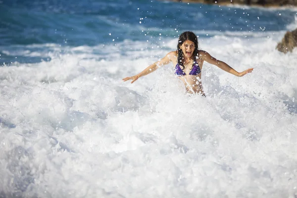 Young woman in storming sea — Stock Photo, Image
