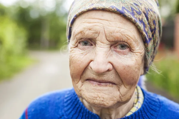Beautiful aged woman with kerchief — Stock Photo, Image