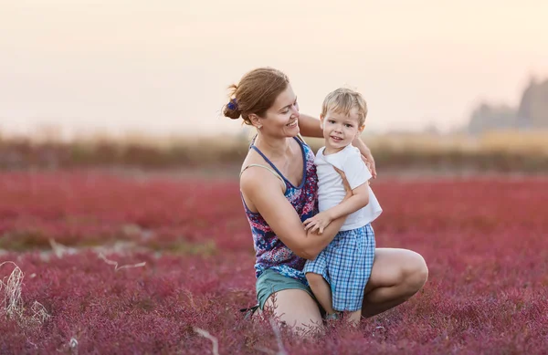 Young woman and her son outdoors — Stock Photo, Image