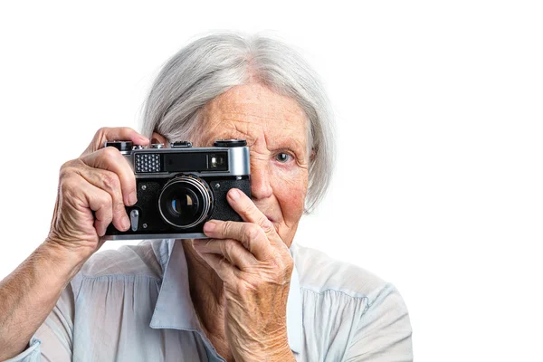 Woman shooting with retro camera — Stock Photo, Image