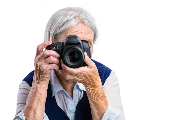 Woman shooting with digital camera — Stock Photo, Image