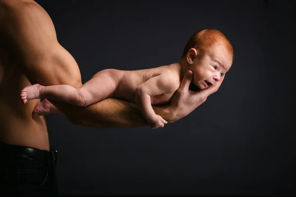 Caucasian man holding little son — Stock Photo, Image