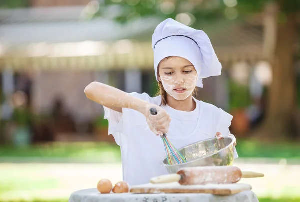 Little chef whipping eggs — Stock Photo, Image