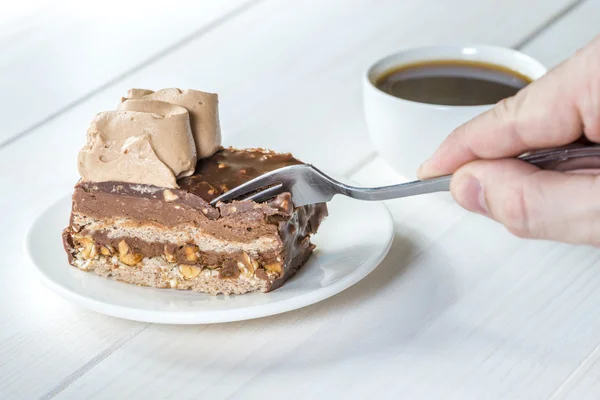 Eating chocolate cake with a fork — Stock Photo, Image