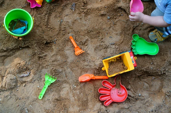 Children's toys in the sandbox — Stock Photo, Image