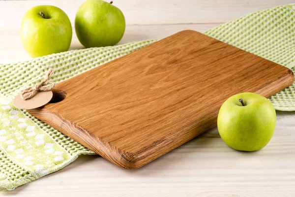 empty wooden board and apples copy space layout, template for food background, copy space and cutting board for your text