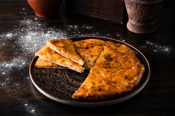 Khychiny Traditional caucasian flatbread filled with cheese and herbs. Flat bread, National dish of Georgian cuisine is khachapuri flatbread with cheese, Georgian Flatbread Khachapuri