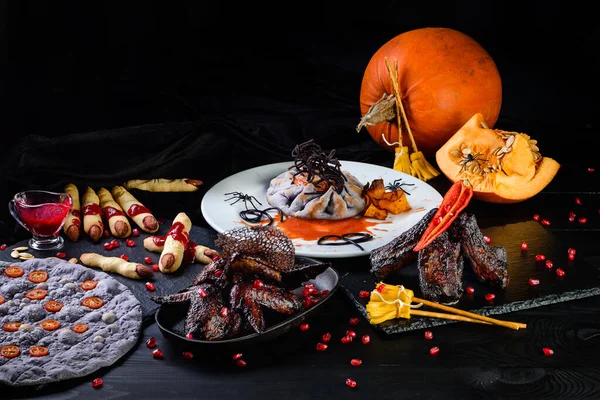 Halloween party table served. Food table arrangement prepared for Halloween party.