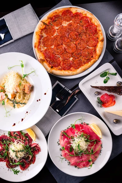 Italian food set pizza pepperoni, pasta and tartare — Stockfoto