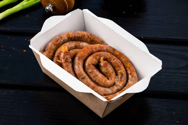 Grilled Sausage Circle Food Delivery Box Traditional Spiral Pork Sausages — Stock Photo, Image