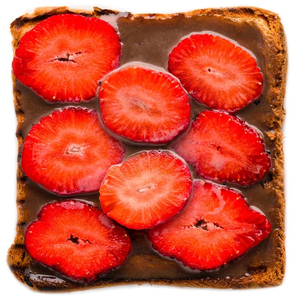 Breakfast whole wheat bread toast and chocolate spread top with strawberry, a sandwich with chocolate and strawberries isolated on white background